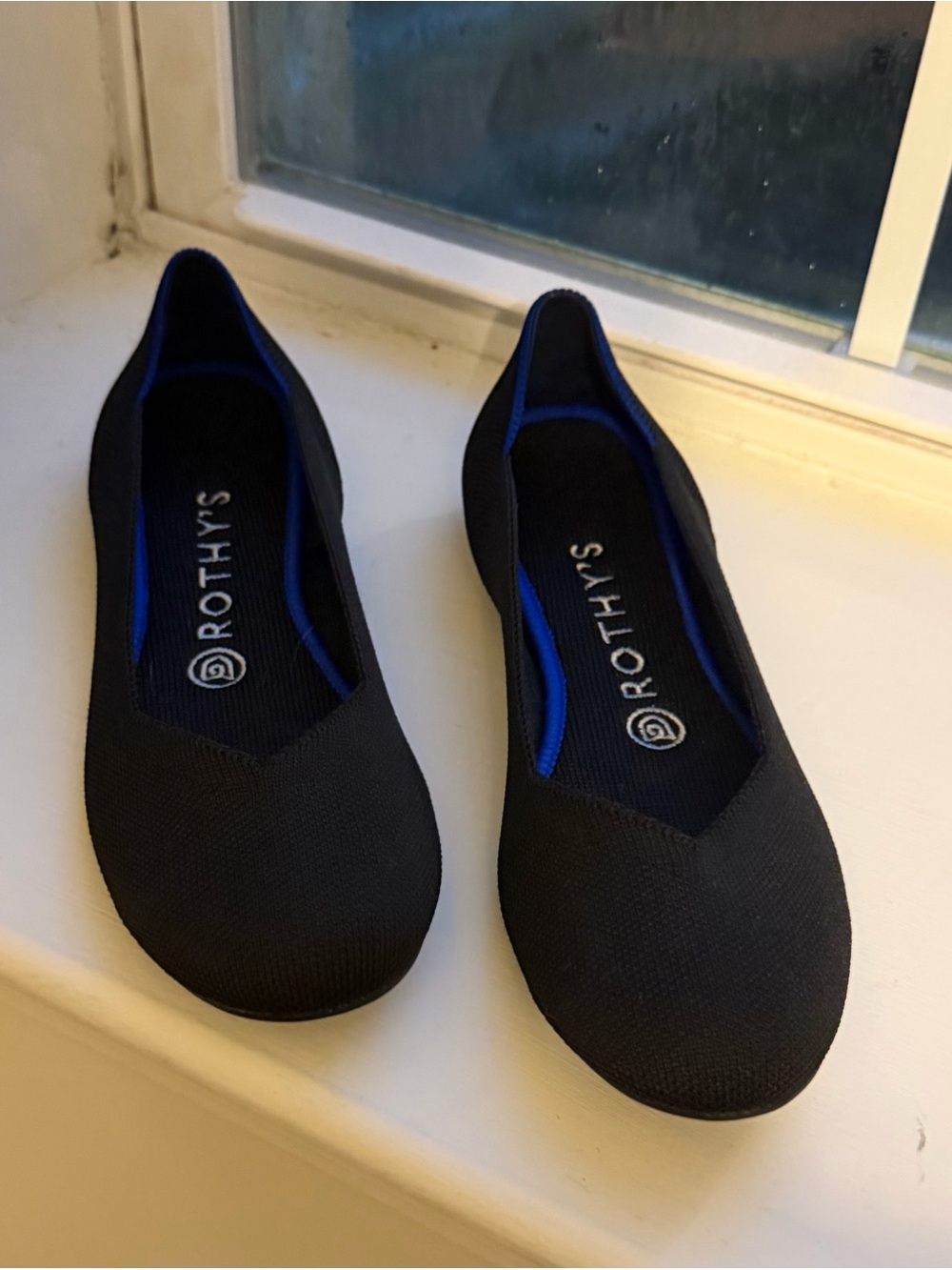Rothy's Black Flats with Blue Interior Trim